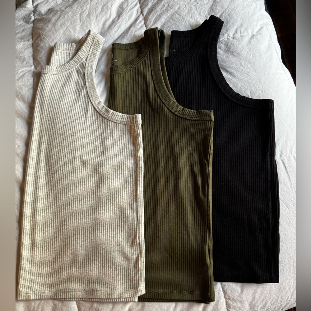 Set of 3 GAP wmns XL racerback ribbed tanks in heathered grey, olive, and black.